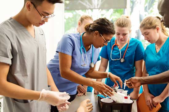 Multi-ethnic group of College students in nursing class.